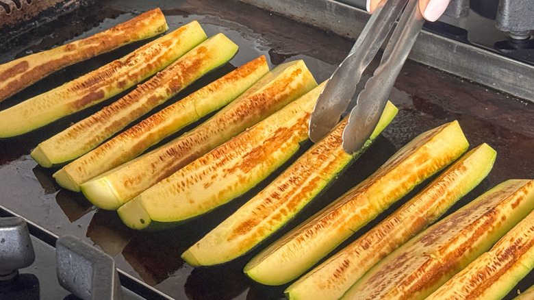zucchini cooking on grill pan