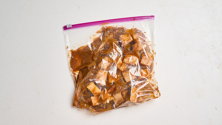 swordfish covered in marinade in a bag