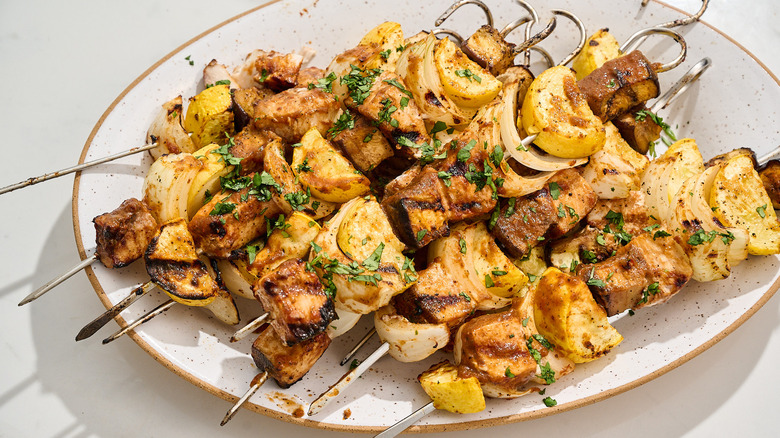 swordfish kebabs on a platter