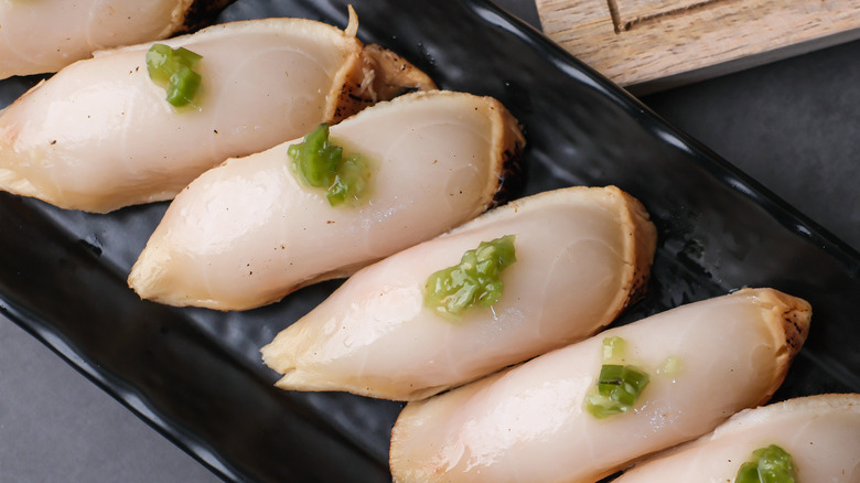 Top view of Escolar, oilfish, butterfish nigiri, or sashimi with fresh wasabi. Traditional Japanese food