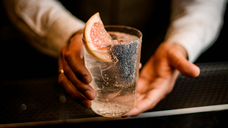 white cocktail with grapefruit wedge