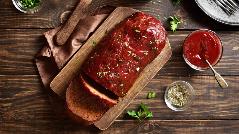 Sliced meatloaf on a cutting board