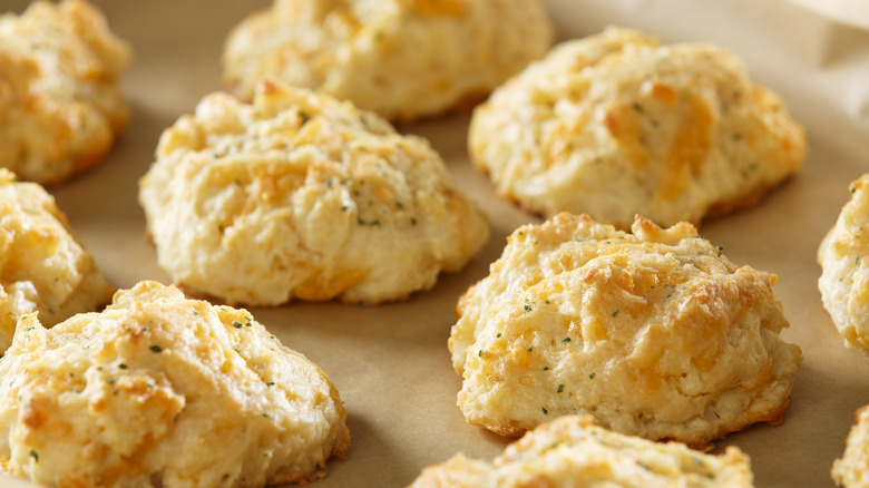 Cheddar biscuits on parchment paper