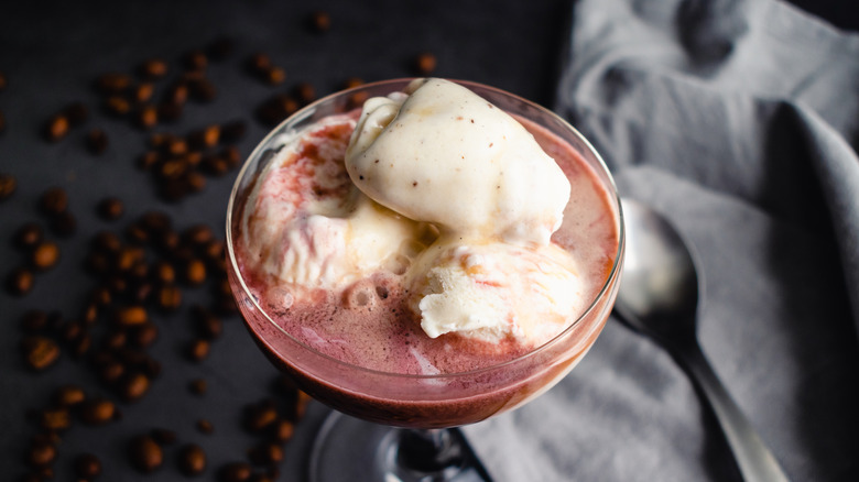 A red wine float in a wide glass.