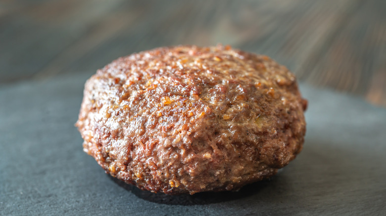 Closeup of a steak made with ground beef on a table