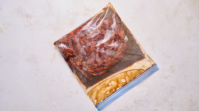 beef jerky sealed in a bag with marinade