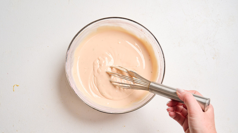 whisking pie ingredients together in a bowl