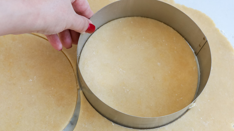 empanada dough being cut into circles