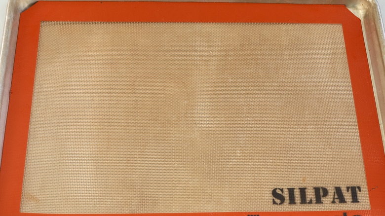 baking sheet with a silpat mat on in