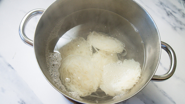 Boiling noodles in pot