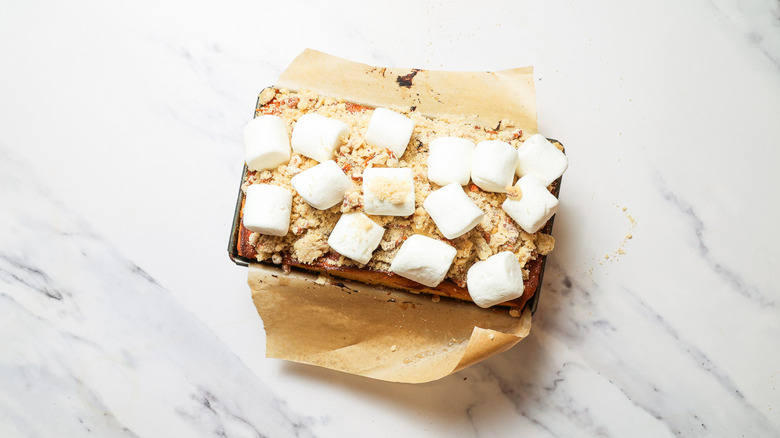 Cake topped with crumble and marshmallows