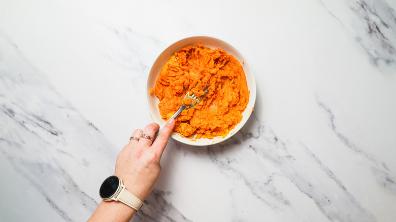 Mashing sweet potato puree