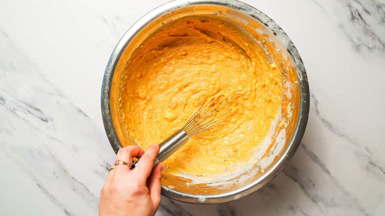 Mixing wet and dry ingredients in bowl