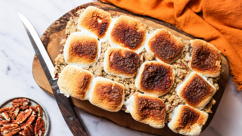 Sweet potato pound cake with knife on board