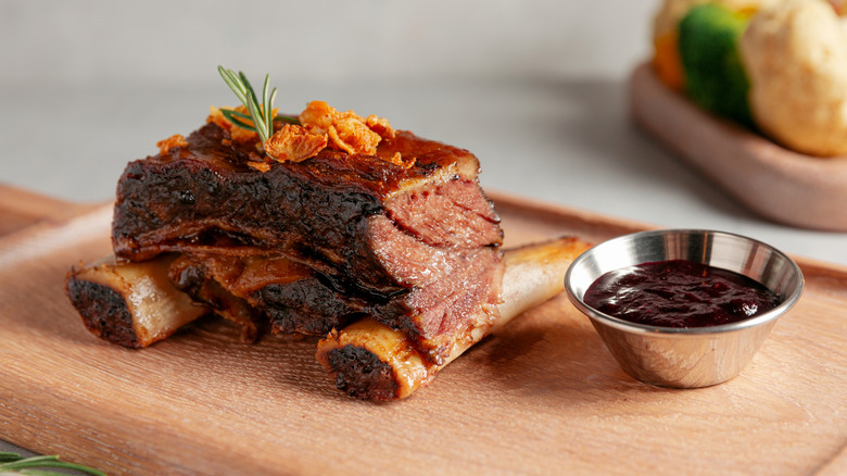tomahawk steak with side of sauce