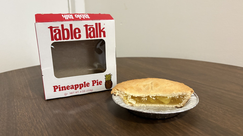 Table Talk pineapple pie slice on a tray with the box in the back