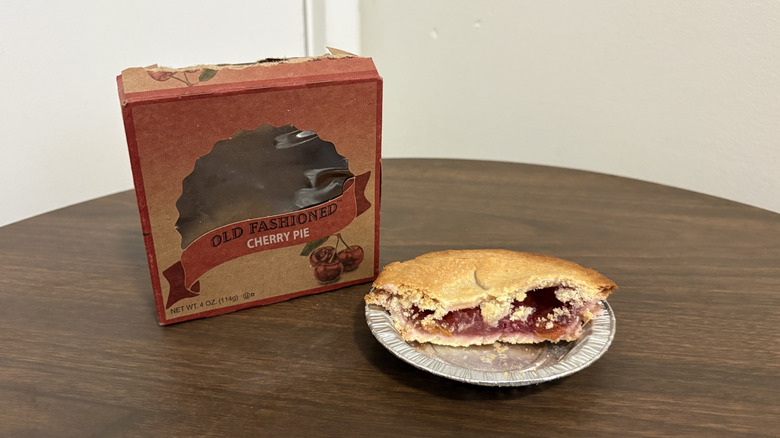 Table Talk old fashioned cherry pie sliced in half with the box