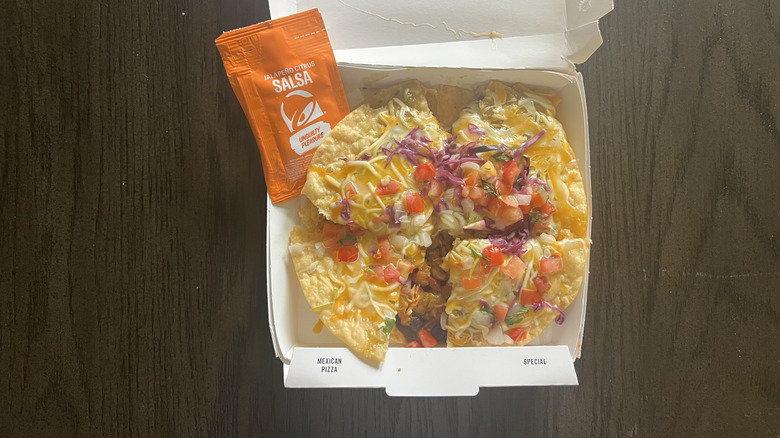 Taco Bell Cantina Chicken Mexican Pizza with sauce.