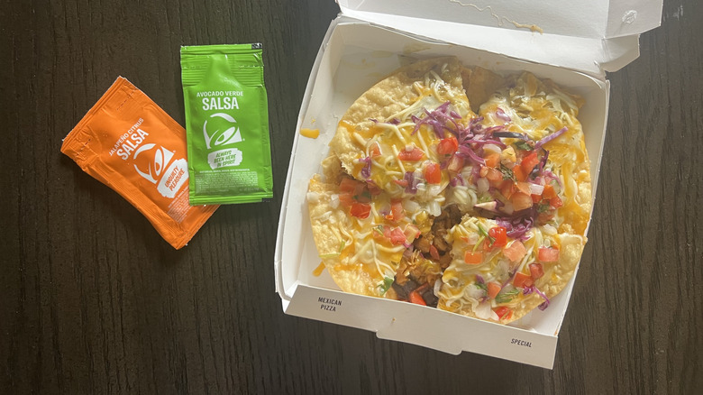 Taco Bell Cantina Chicken Mexican Pizza with sauce.