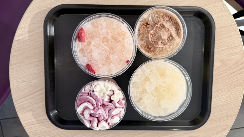 overhead shot of four horchata-inspired drinks at Taco Bell