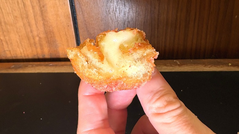 Half of a Strawberry Cinnabon Delight bitten into