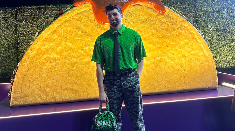 The author standing in front of a giant taco at Live Más Live 2026