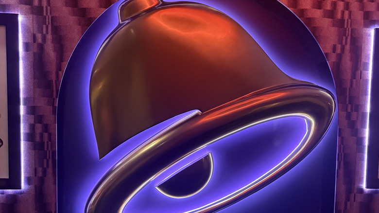 A sign depicting the titular bell from Taco Bell inside the venue