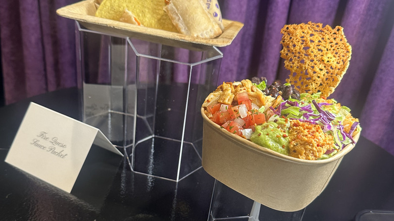 The Queso Cracked Cantina Bowl with a parmesan crisp sticking out the side