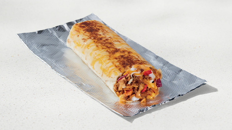 Taco Bell grilled cheese burrito on beige background