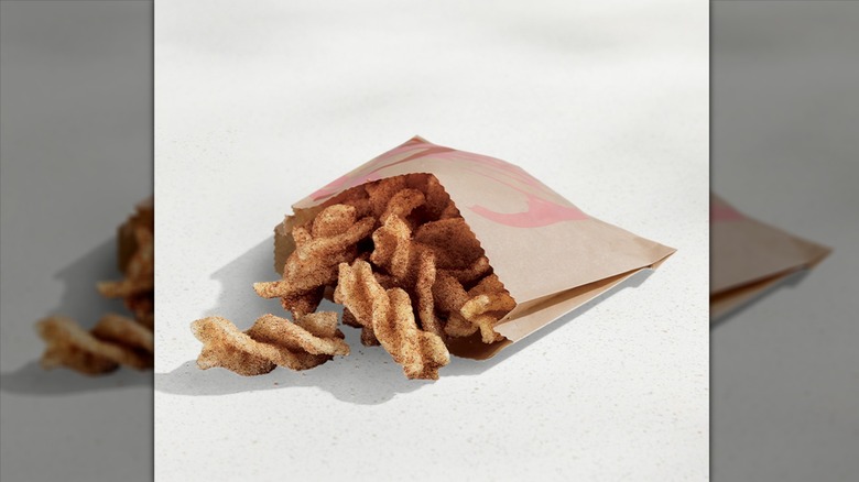 Taco Bell cinnamon twists on beige background