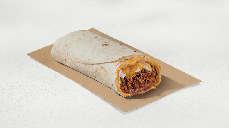 Taco Bell beefy five layer burrito on beige background