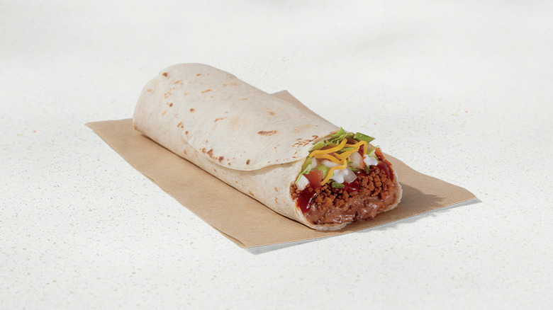 Taco Bell burrito supreme on beige background