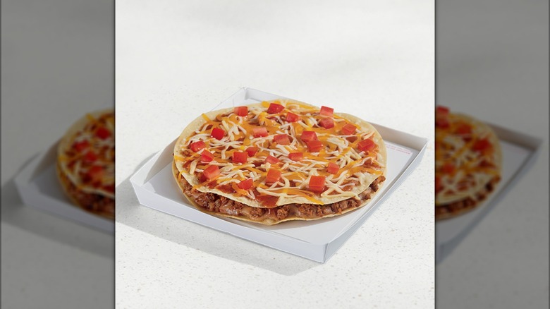 Mexican Pizza with tomato pieces in a tray