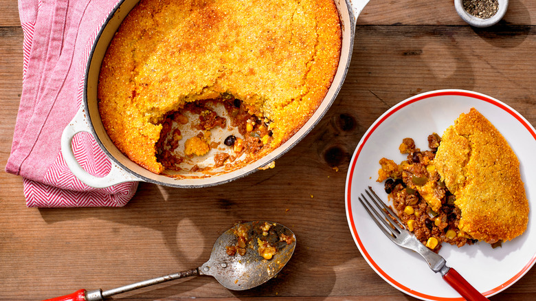Overhead view of cornbread baked with black beans, corn, and meat
