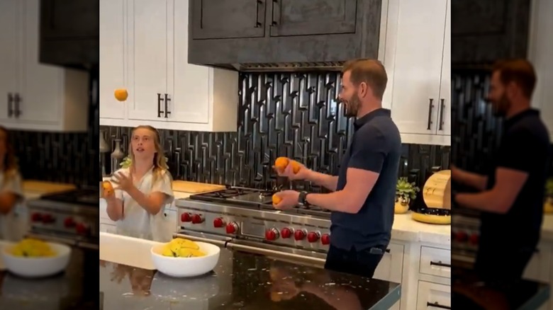 Tarek El Moussa and daughter in kitchen