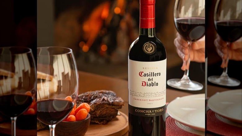 Wine bottle with glass of red wine