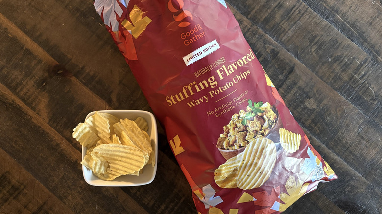 Good & Gather stuffing flavored wavy potato chips in bag and bowl on wooden table.