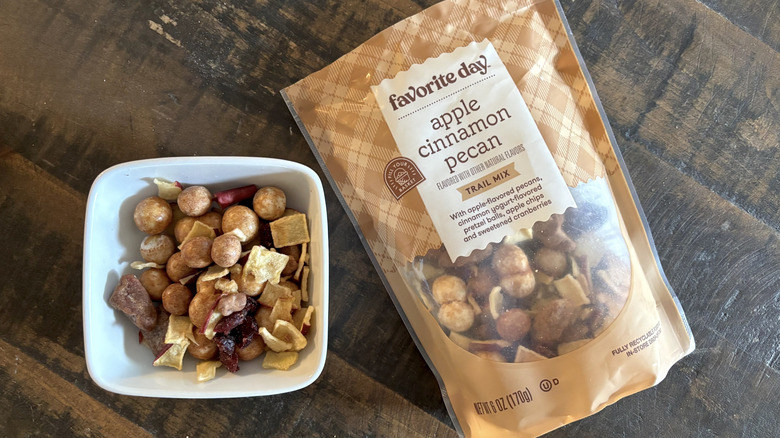 Favorite Day apple cinnamon pecan trail mix on a wooden table.