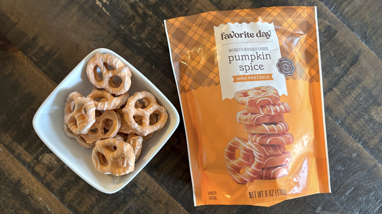 Favorite Day pumpkin spice mini pretzel twists in bag and bowl on wooden table.