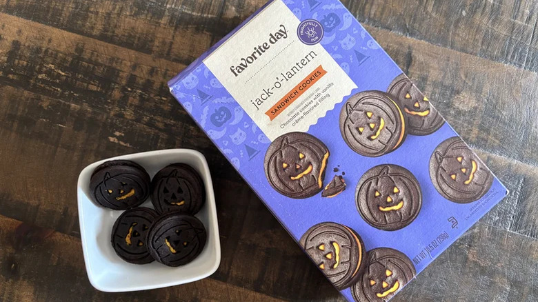 A box of the Target Favorite Day Jack-O-Lantern cookies next to a small bowl of the cookies