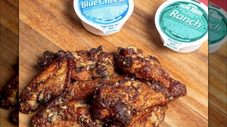 Papa John's wings with accompanying Blue Cheese and Ranch sauces