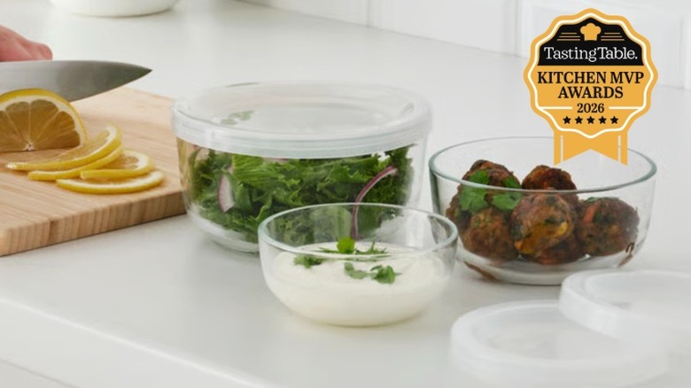 Fresh lettuce, veggie balls, and dip in three different glass Ikea containers.
