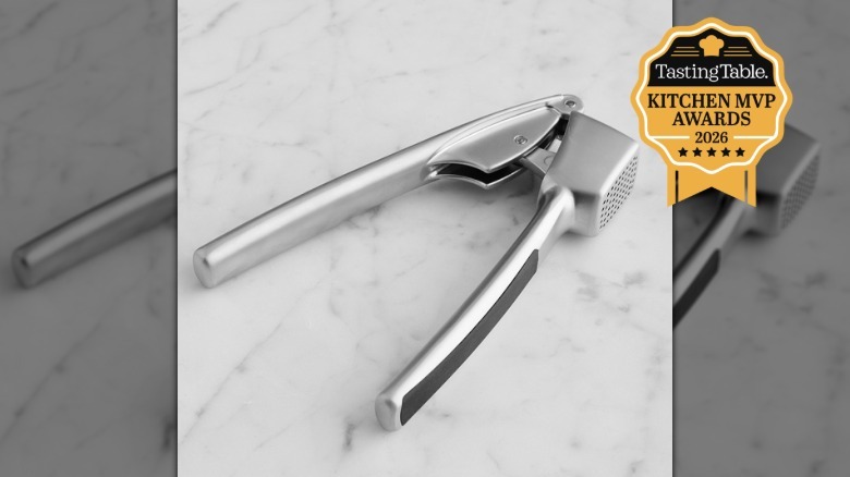 Garlic press on a marble surface