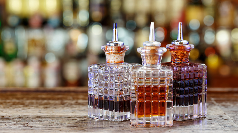 Three bitters bottles on bar