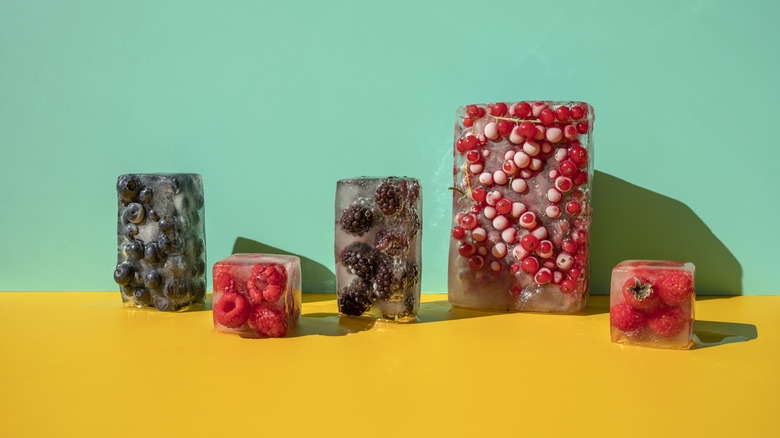 Differently sized ice cubes with fruit