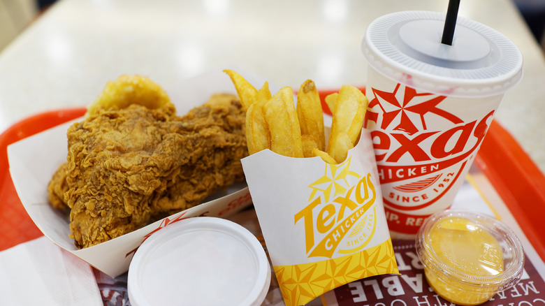 Church's Texas Chicken meal on a red tray on a restaurant table