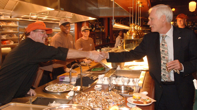 Ted Turner greets workers at Ted's Montana Grill opening