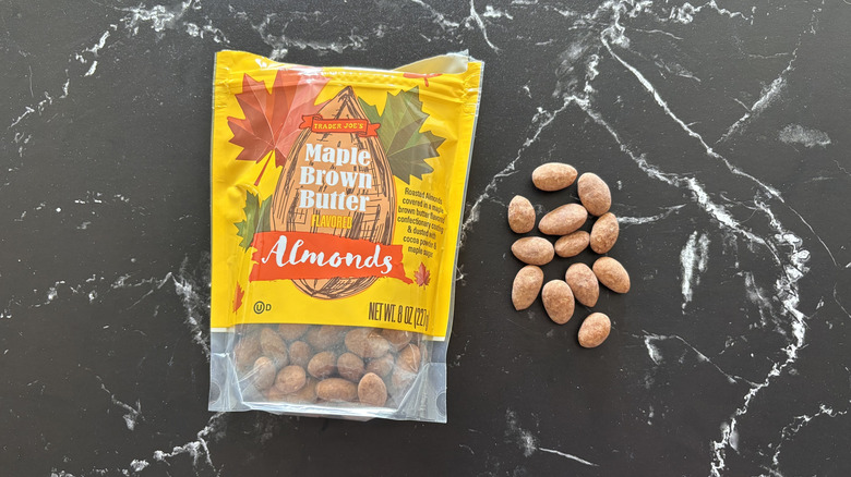 Trader Joe's maple brown butter almond bag next to almonds on countertop