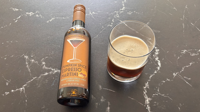 Trader Joe's pumpkin spice espresso martini bottle next to serving in glass
