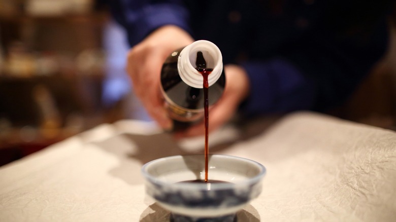 Soy sauce being poured 